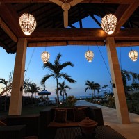 At nightfall relax on the terrace of the holiday in Bali.