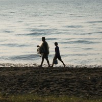 Balinese fisherman along the beach.