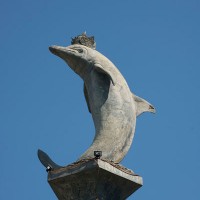 A stone statue of a dolphin in Bali.
