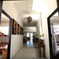 The hallway to the living room with the bedrooms on either side.