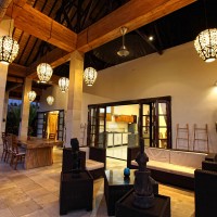 The terrace of the holiday villa in Bali at night looks gorgeous.