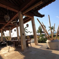 The villa has a terrace overlooking the Bali sea.