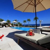 Relaxing at the pool with a view of the sea in Bali.