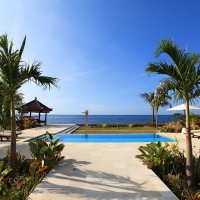 From the villa you walk through a beautiful garden at our pool overlooking the Bali sea.