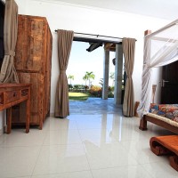 From the bedroom you can walk on the terrace of the villa in Bali.