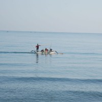 The locals fishing on the Bali sea.