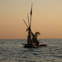 A raft with decorations at sea.