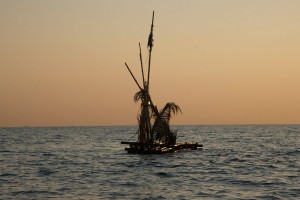 A raft with decorations at sea.