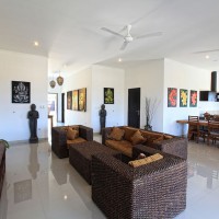 The villa has a spacious living and dining area.