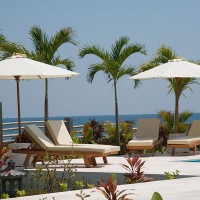 Relax in the luxurious lounge chairs located along the pool of our holiday in Bali.