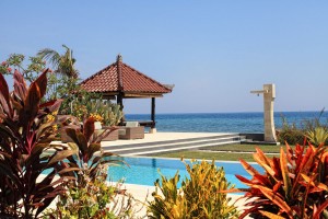 Swimming pool at holiday villa in Bali with lounge area.
