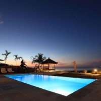 The illuminated pool of our holiday in Bali looks beautiful at night.
