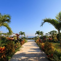 You can walk to the sea over the path through the well-tended garden of the holiday in Bali.
